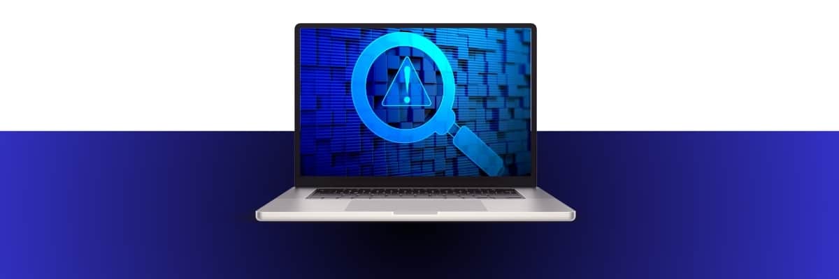 a laptop with a magnifying glass on the screen